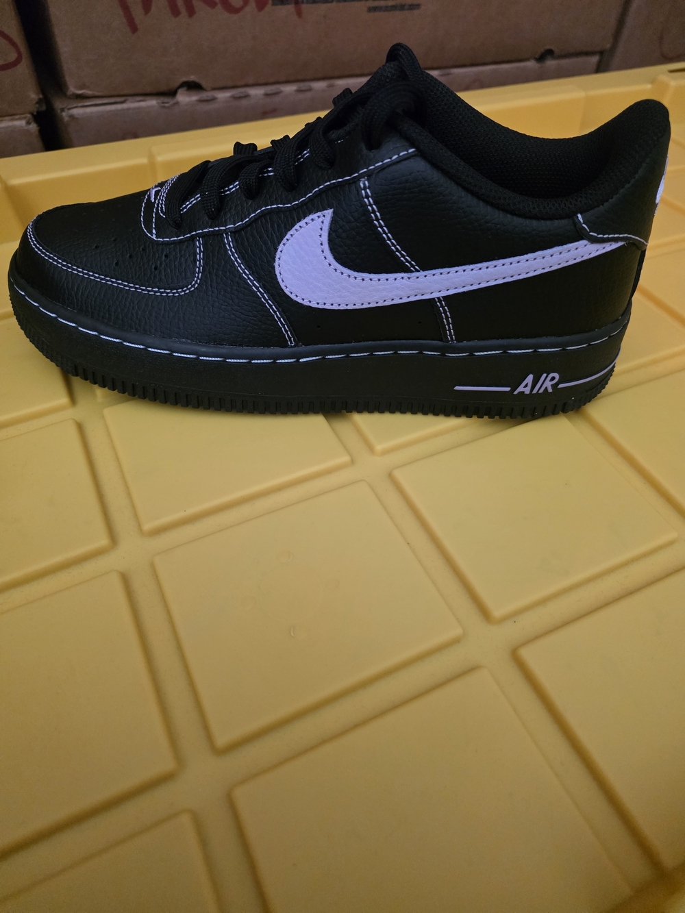 Kids Black Sneakers with White Swoosh Accent - Classic Casual Shoe